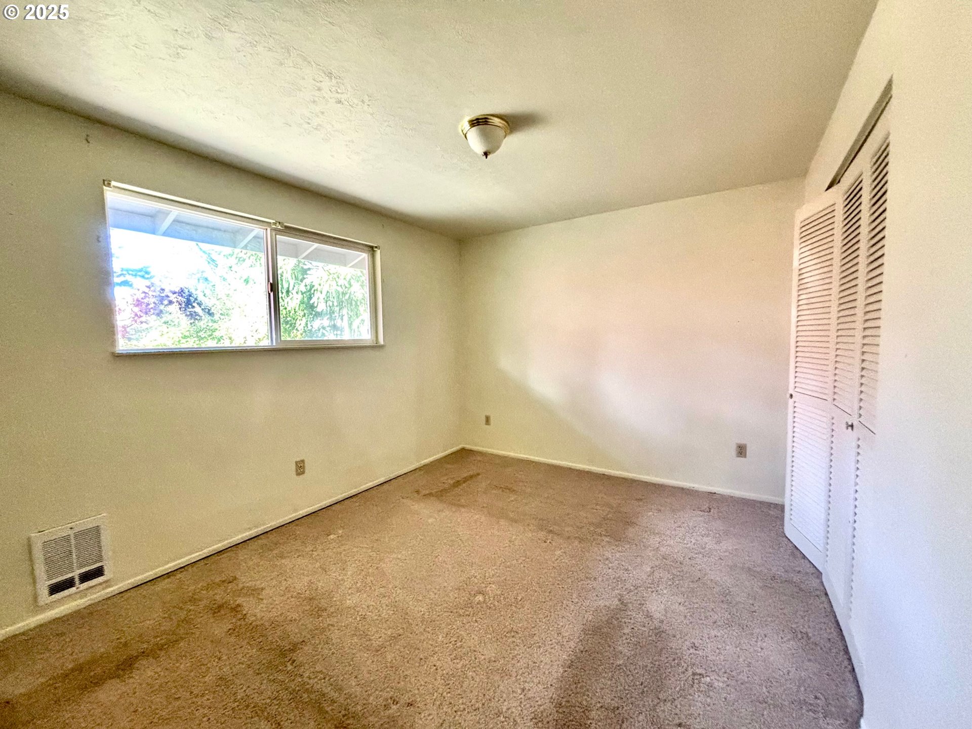 3314 Munsel Lake Road Florence, OR 97439 - Photo 20 of 29 an empty room with windows