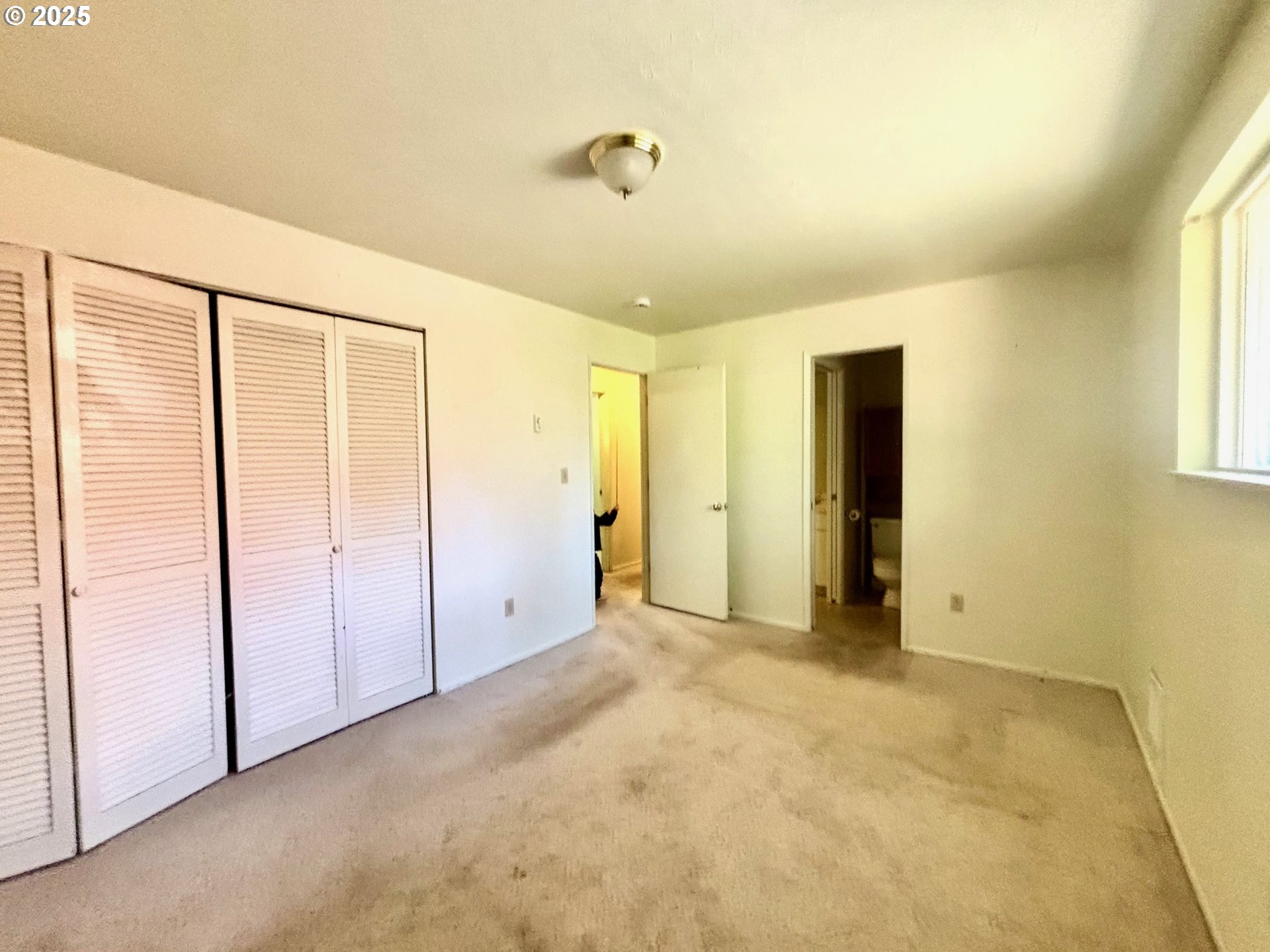 3314 Munsel Lake Road Florence, OR 97439 - Photo 21 of 29 a view of an empty room with a window