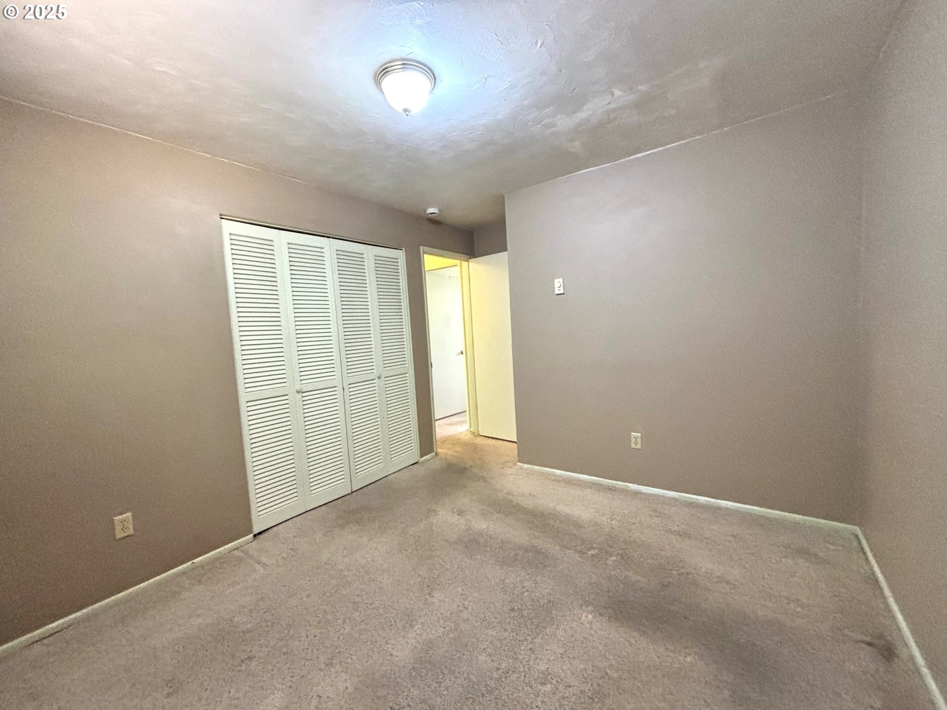 3314 Munsel Lake Road Florence, OR 97439 - Photo 23 of 29 a view of an empty room with a window