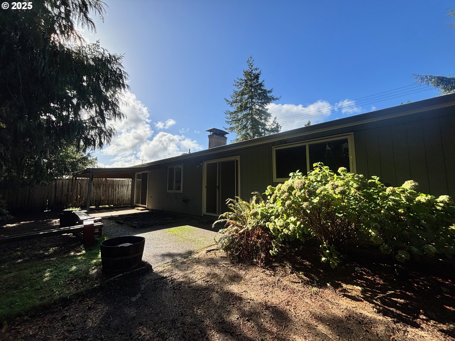 3314 Munsel Lake Road Florence, OR 97439 - Photo 24 of 29 a row of flower plants with wooden fence