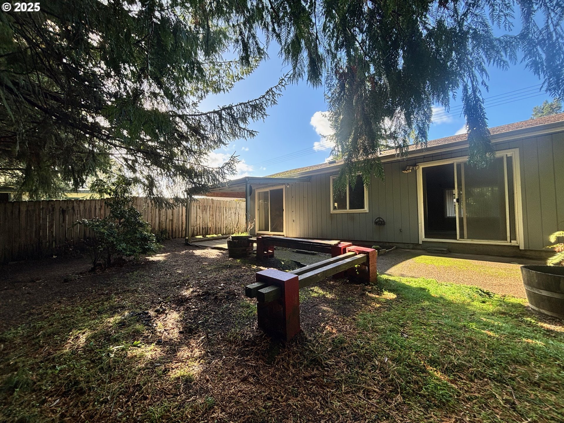 3314 Munsel Lake Road Florence, OR 97439 - Photo 25 of 29 a backyard of a house with yard and outdoor seating