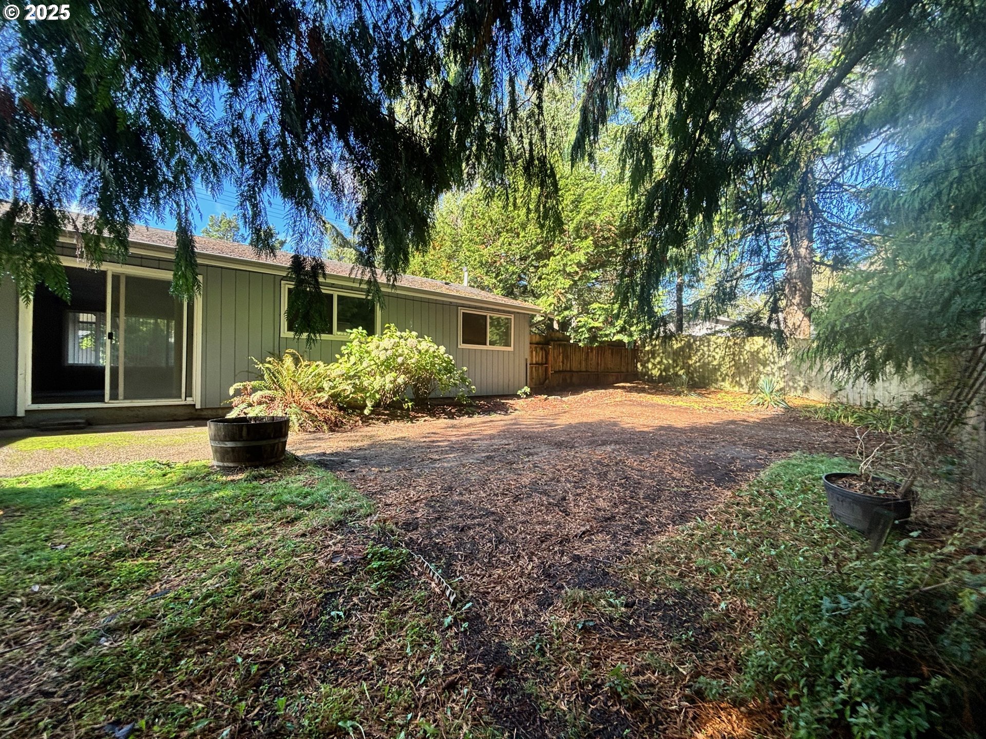 3314 Munsel Lake Road Florence, OR 97439 - Photo 27 of 29 a house with trees in front of it