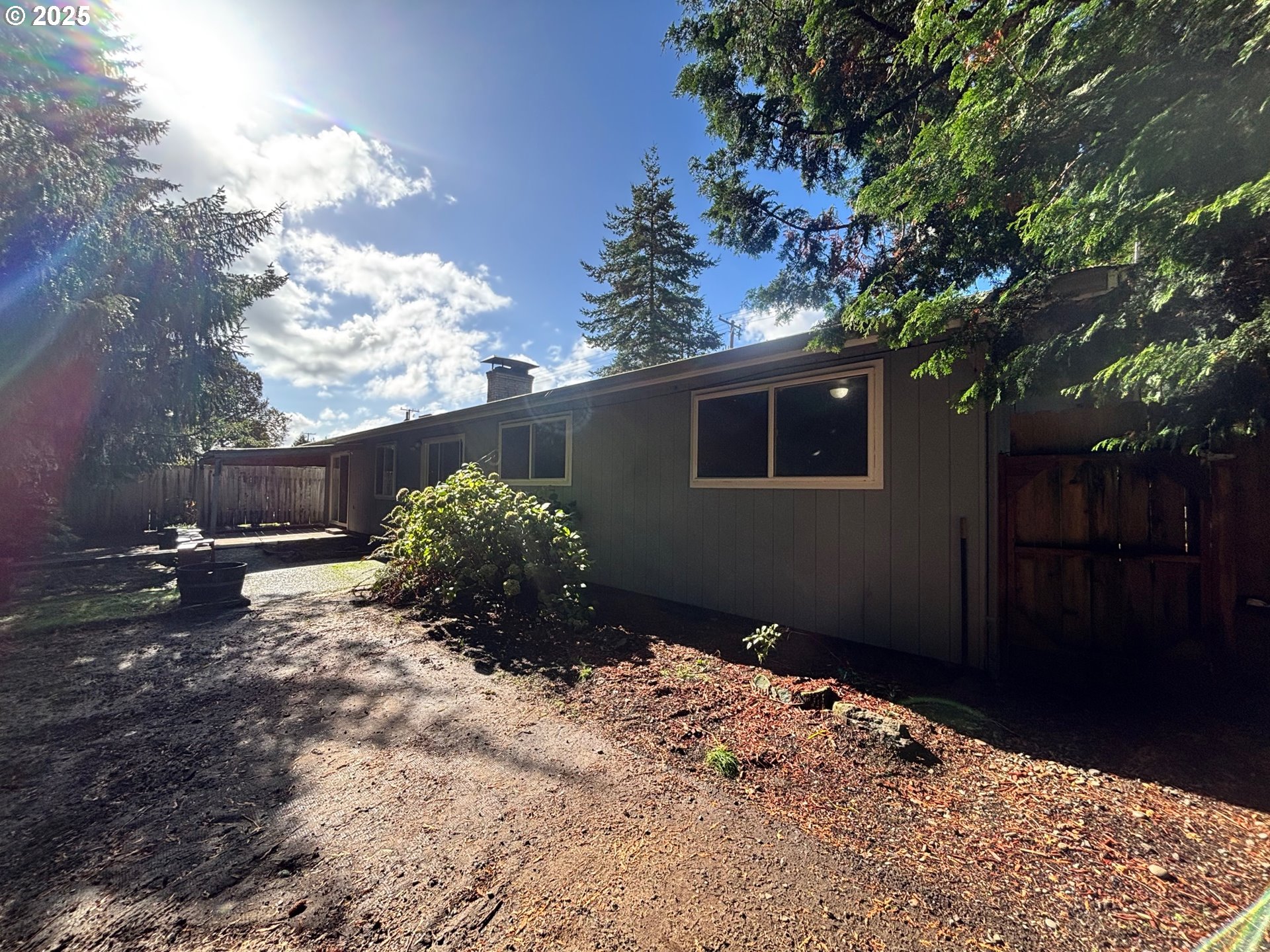 3314 Munsel Lake Road Florence, OR 97439 - Photo 28 of 29 a backyard of a house with lots of green space