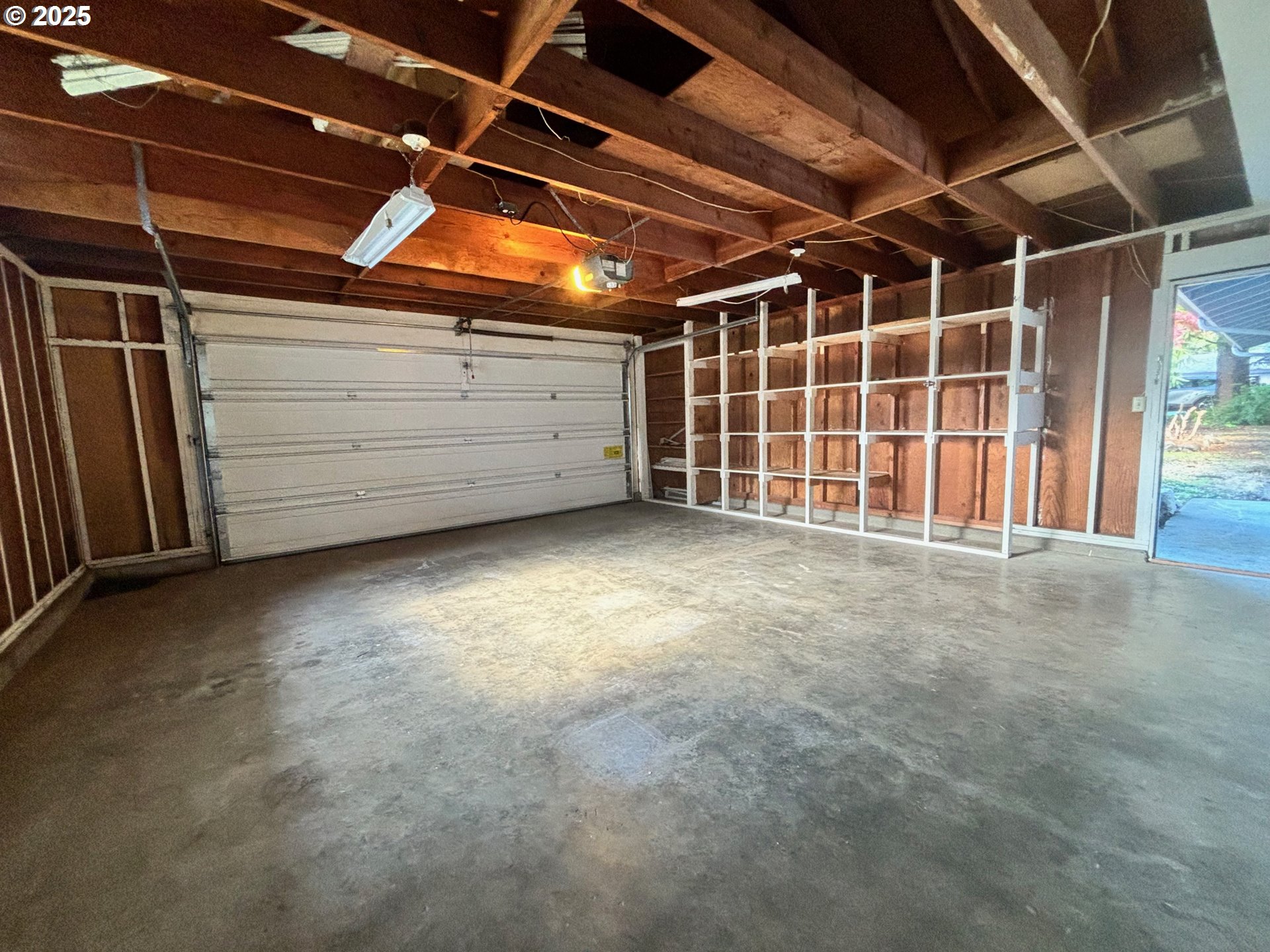 3314 Munsel Lake Road Florence, OR 97439 - Photo 6 of 29 a view of an empty room with a garage