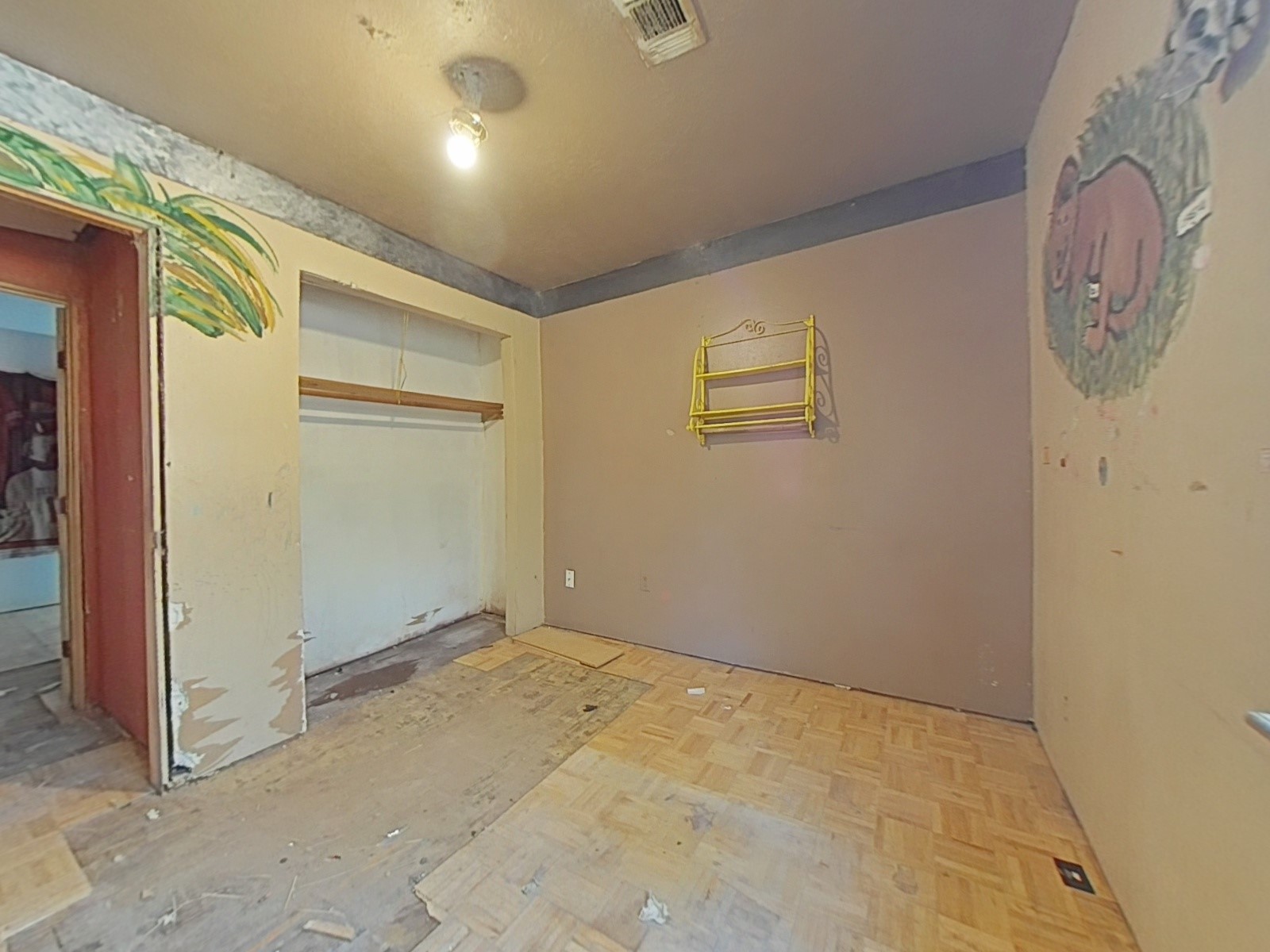 1705 Spring Ridge Road Coldspring, TX 77331 - Photo 15 of 26 an empty room with wall painting and stairs