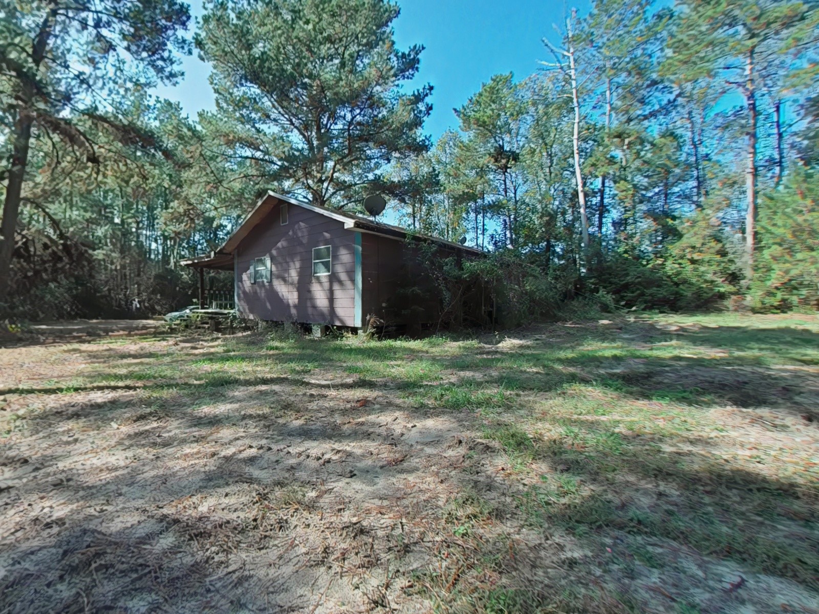 1705 Spring Ridge Road Coldspring, TX 77331 - Photo 20 of 26 a backyard of a house with lots of green space