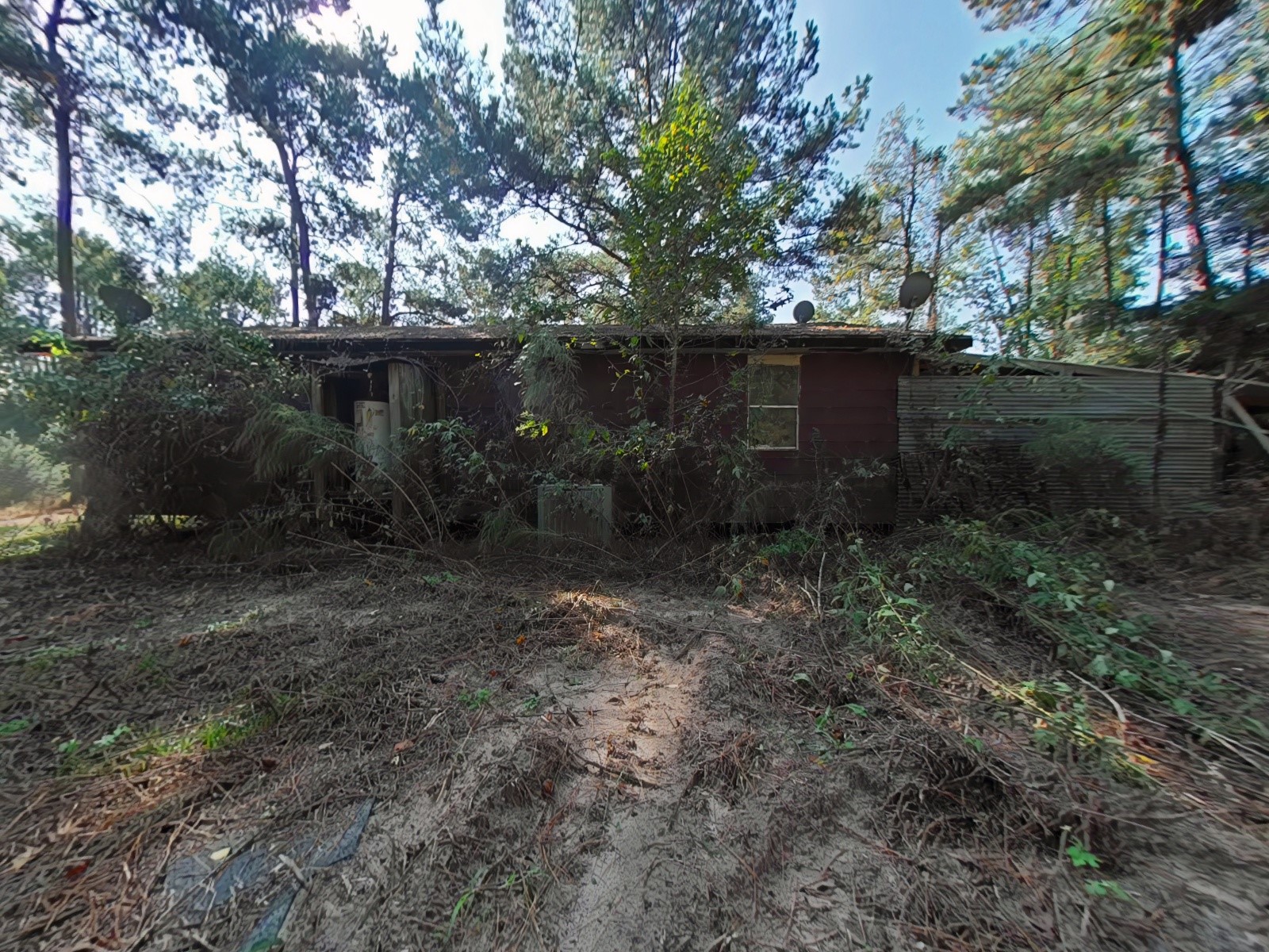 1705 Spring Ridge Road Coldspring, TX 77331 - Photo 22 of 26 a backyard of a house with lots of green space