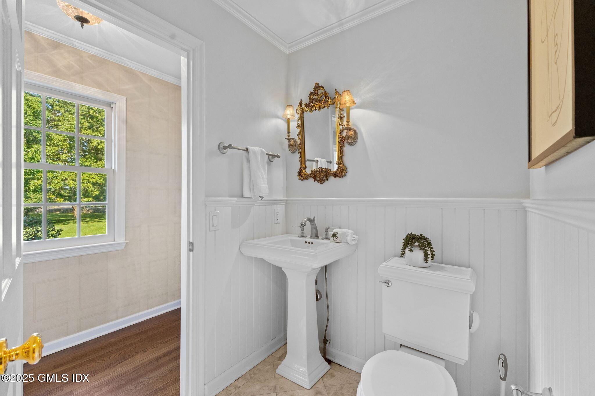 177 Indian Head Road Riverside, CT 06878 - Photo 14 of 25 a bathroom with a toilet sink and mirror