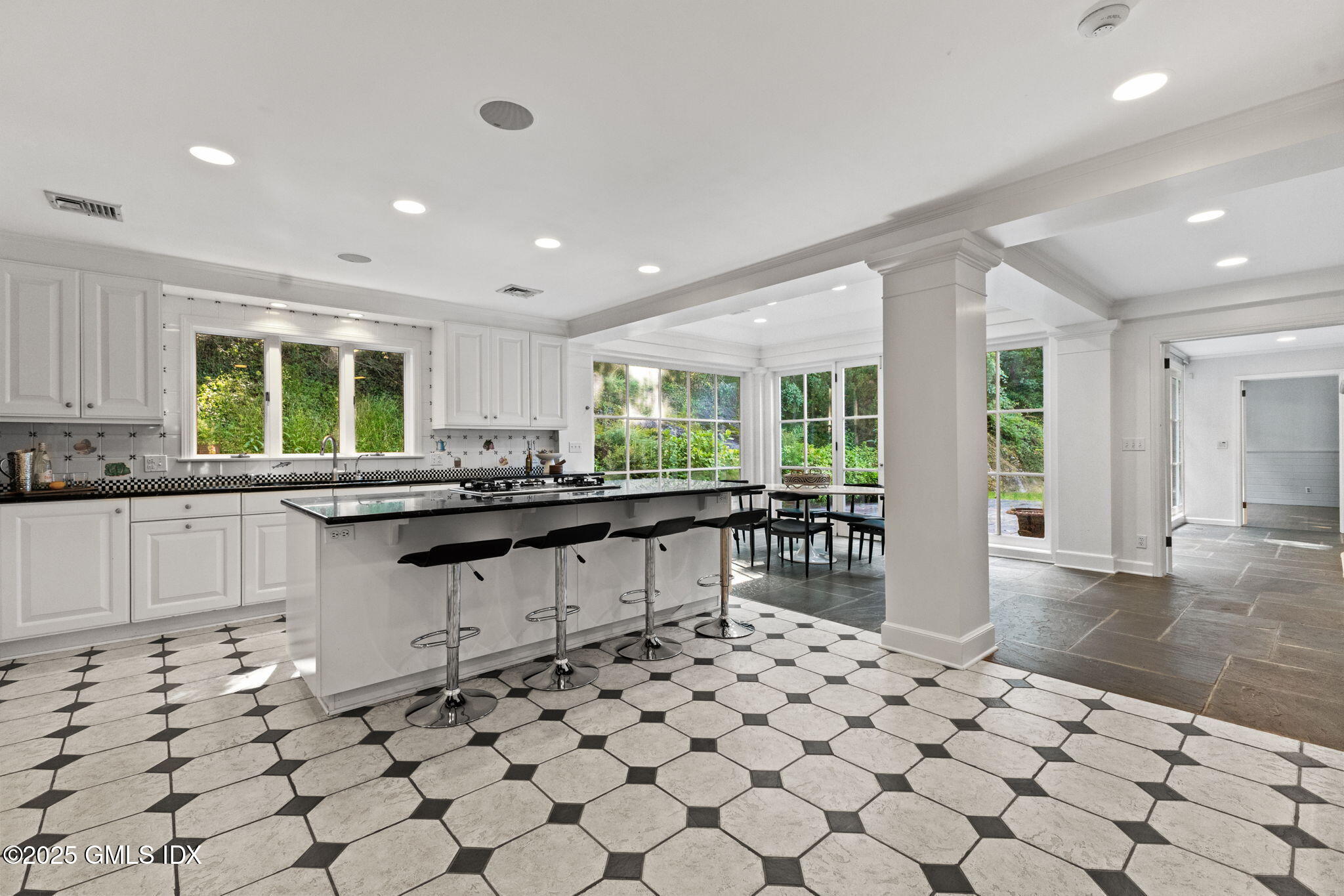 177 Indian Head Road Riverside, CT 06878 - Photo 7 of 25 a kitchen with stainless steel appliances a sink and cabinets