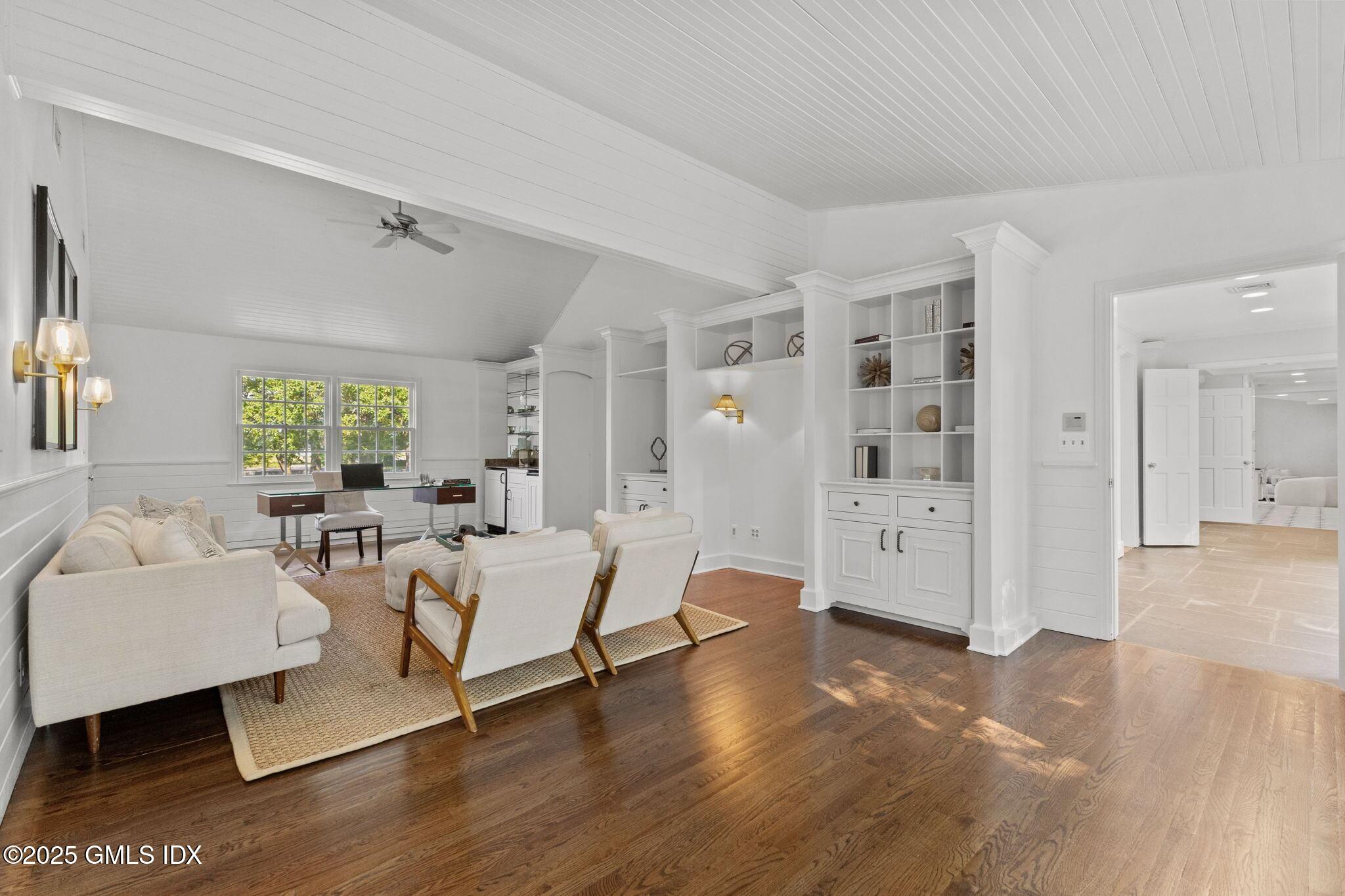 177 Indian Head Road Riverside, CT 06878 - Photo 9 of 25 a living room with furniture and a large window