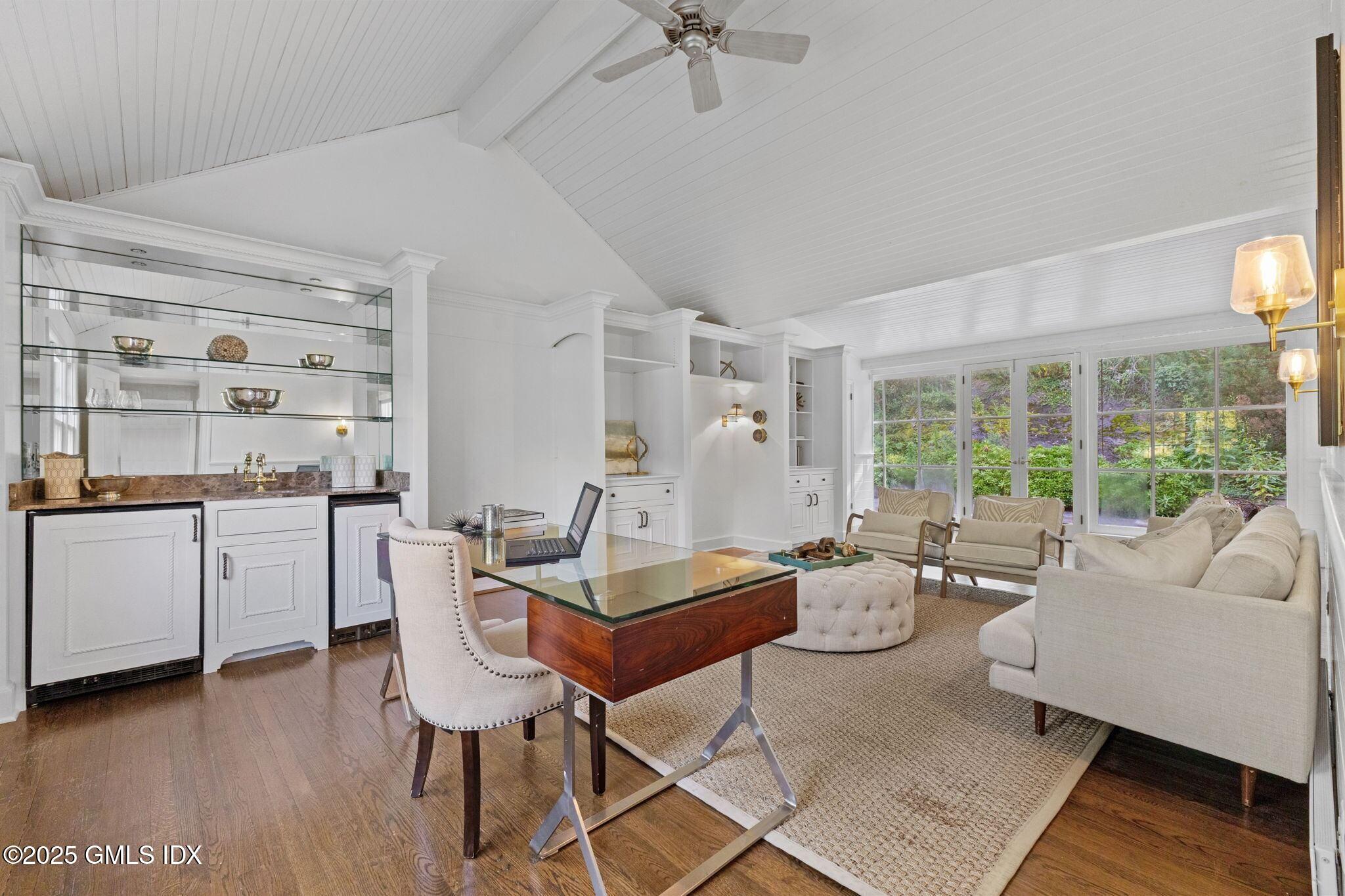 177 Indian Head Road Riverside, CT 06878 - Photo 10 of 25 a living room with furniture and a large window
