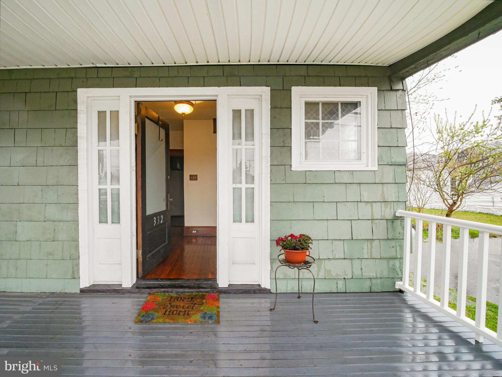 332 Crown Point Road Thorofare, NJ 08086 - Photo 7 of 36 a view of a porch with a table and chairs and potted plants