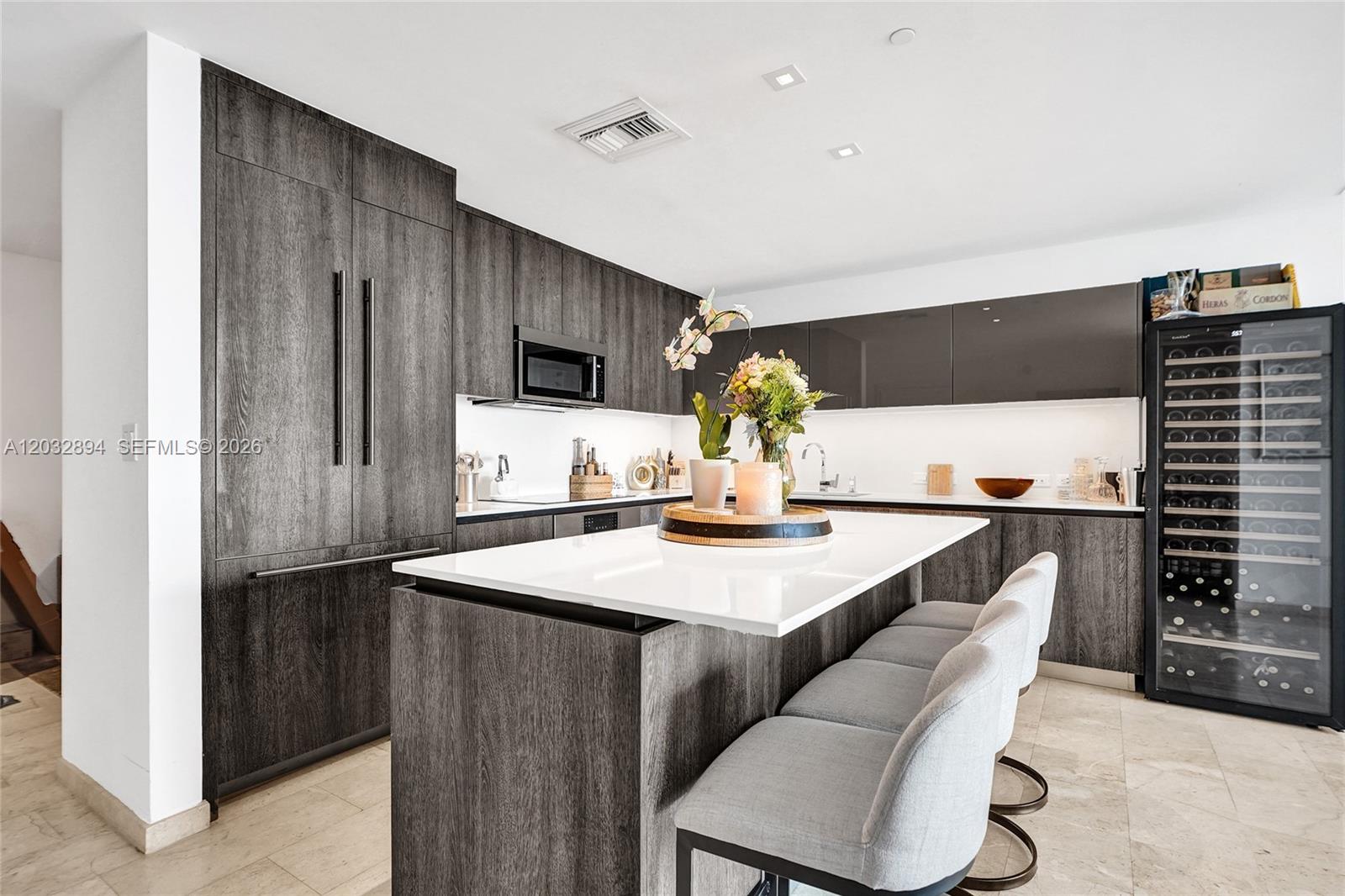 88 Southwest 7th Street, Unit 2210 Miami, FL 33130 - Photo 5 of 24 Eat-in counter in open kitchen