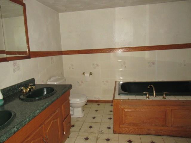 273 Odonnal Road Mill Run, PA 15464 - Photo 11 of 19 a bathroom with a sink a toilet and shower