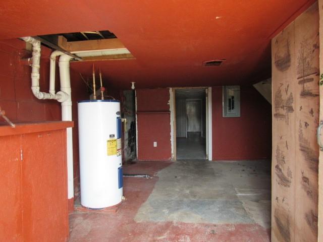 273 Odonnal Road Mill Run, PA 15464 - Photo 16 of 19 a view of a hallway with a refrigerator and dining table