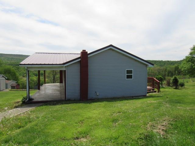 273 Odonnal Road Mill Run, PA 15464 - Photo 2 of 19 a view of a house with backyard and garden