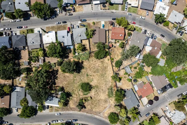 an aerial view of residential houses with outdoor space