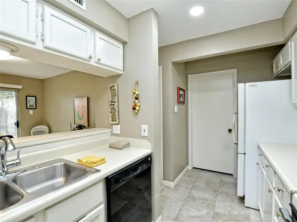 a view of a bathroom sink mirror and a bathtub