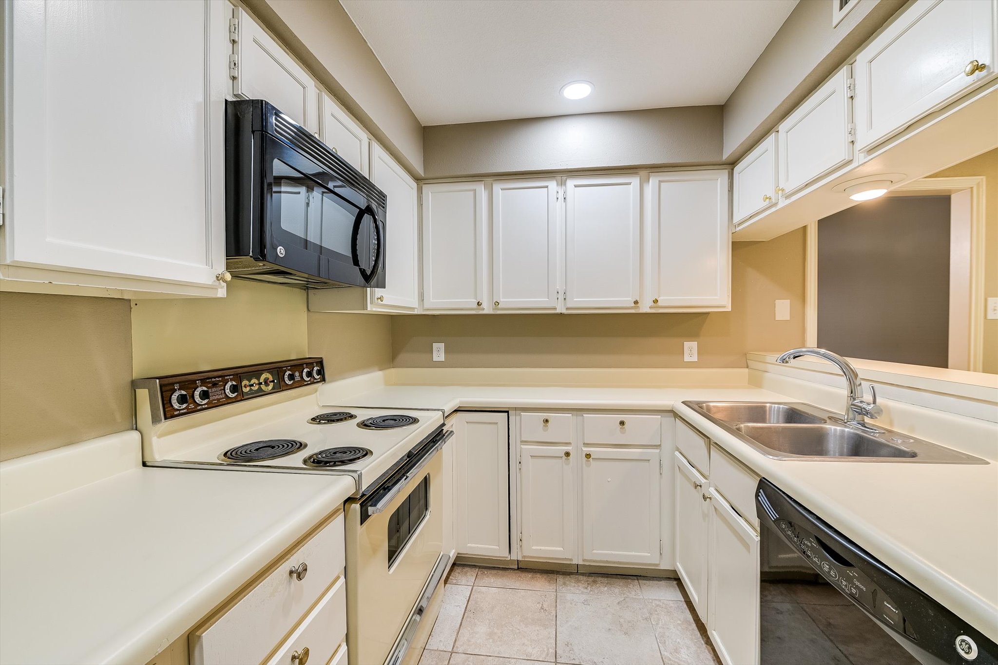 7919 Ridgeline North Austin, TX 78731 - Photo 11 of 23 a kitchen with a sink stove top oven and cabinets