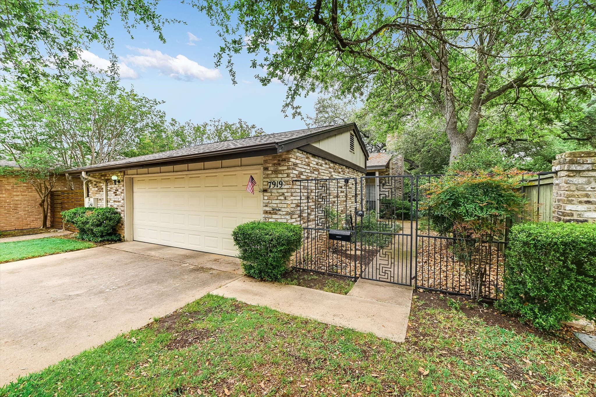 7919 Ridgeline North Austin, TX 78731 - Photo 22 of 23 a view of a house with a yard and potted plants
