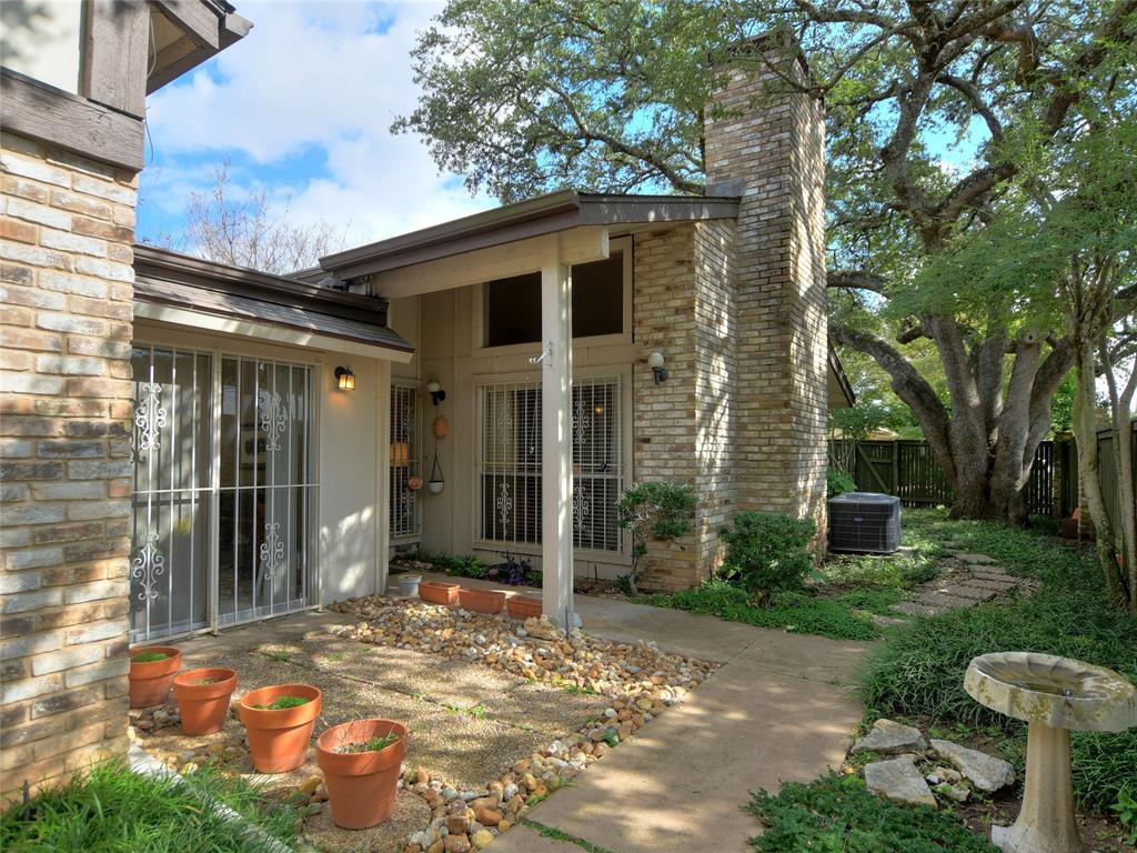 7919 Ridgeline North Austin, TX 78731 - Photo 4 of 23 a view of a house with a yard