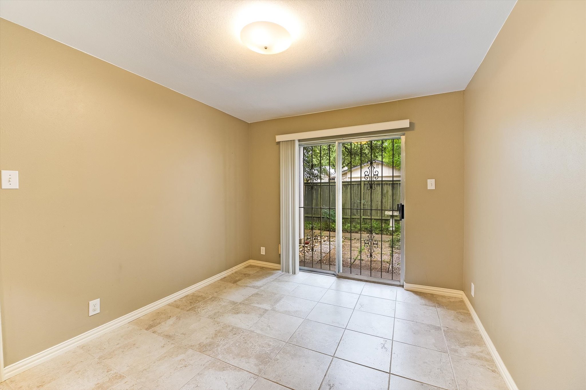 7919 Ridgeline North Austin, TX 78731 - Photo 8 of 23 a view of an empty room with wooden floor and a window