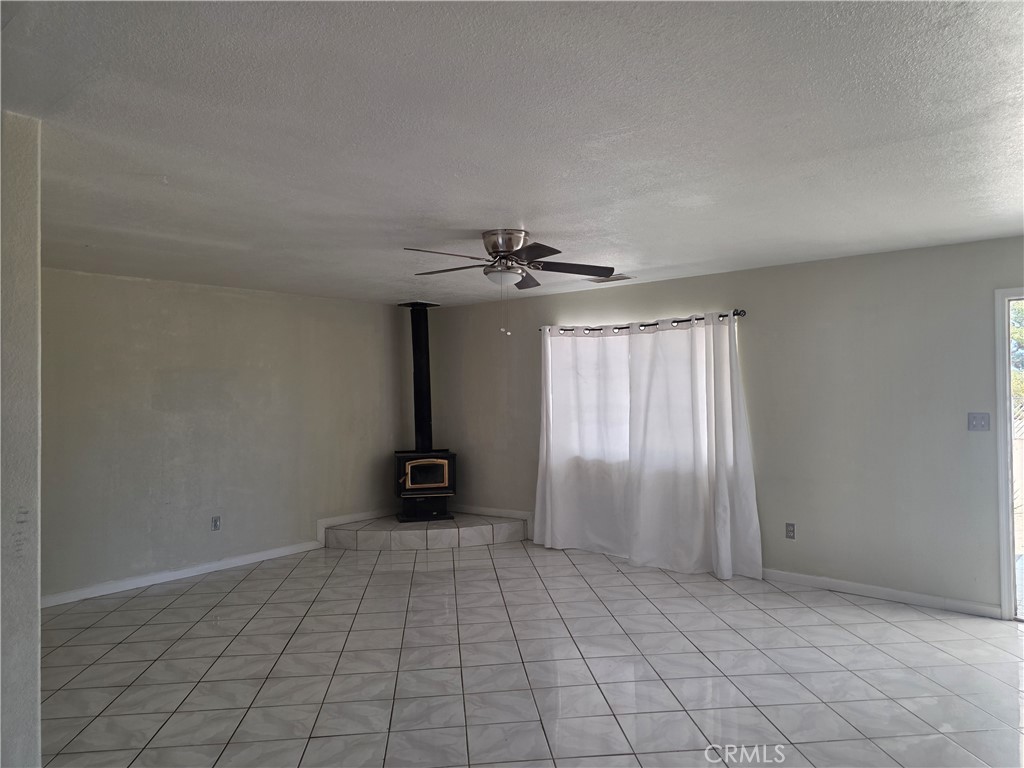 11380 El Esteban Road Phelan, CA 92371 - Photo 10 of 14 Living Room/Wood Burning Stove
