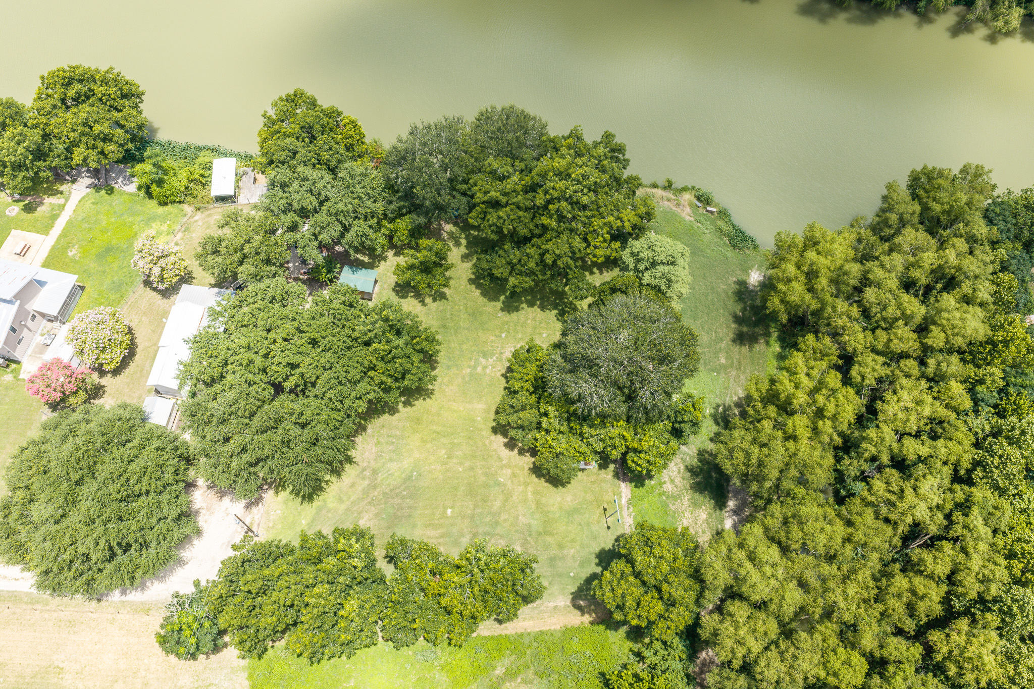 Tbd Goodwin Road Gonzales, TX 78629 - Photo 19 of 33 A tranquil aerial view reveals a verdant landscape bordering a winding waterway.