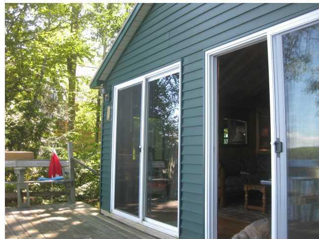 450 Stanhope Mill Road Lincoln, ME 04457 - Photo 13 of 31 Exterior Front. TWO sliders out to...