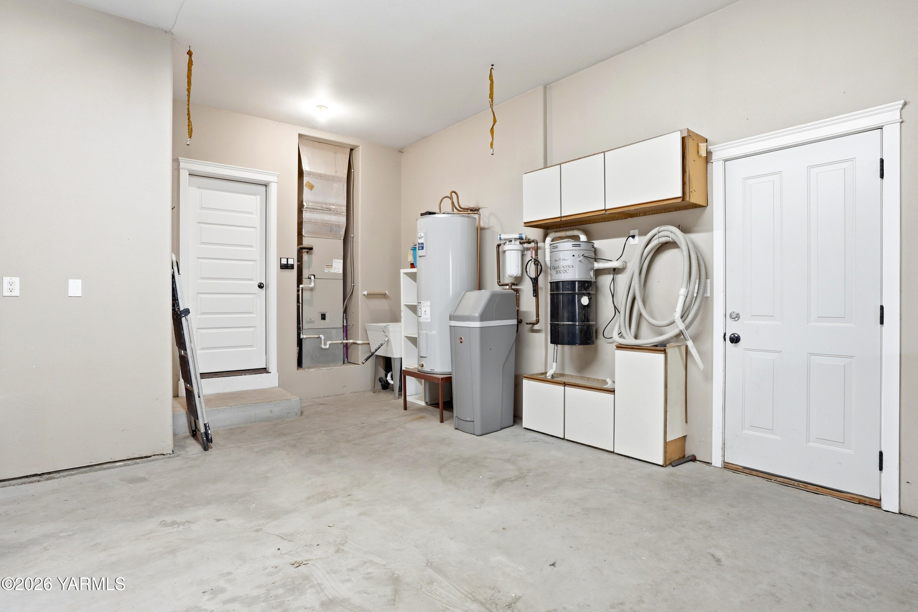 230 Albro Road Sunnyside, WA 98944 - Photo 33 of 46 a view of a storage & utility room with refrigerator