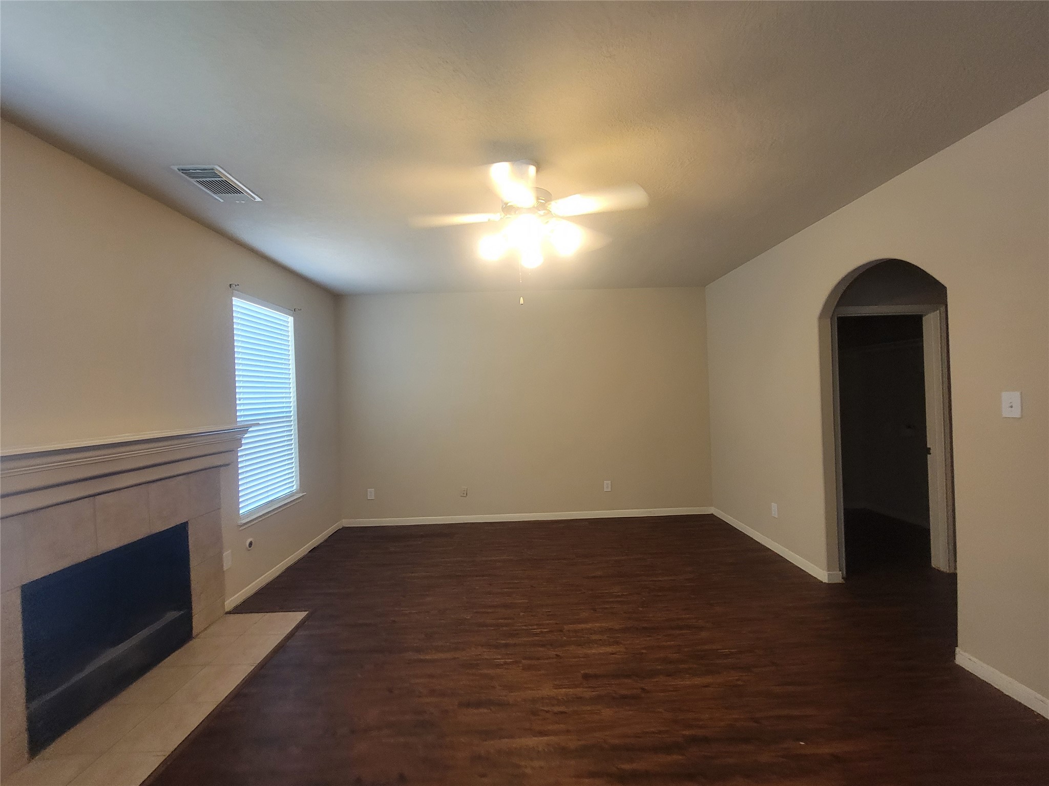 3110 Clover Ranch Circle Katy, TX 77494 - Photo 13 of 28 a view of empty room with wooden floor and fireplace