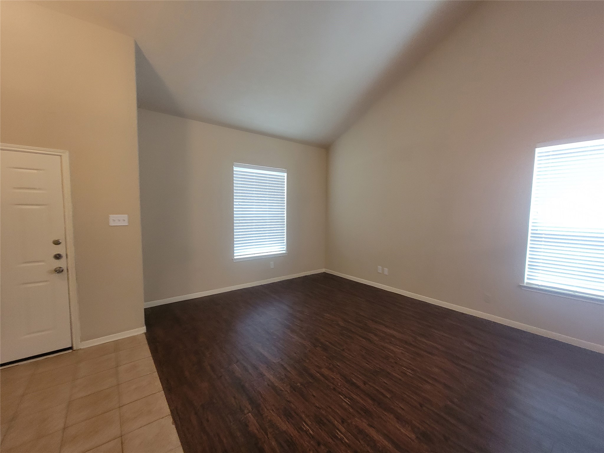 3110 Clover Ranch Circle Katy, TX 77494 - Photo 2 of 28 an empty room with wooden floor and windows