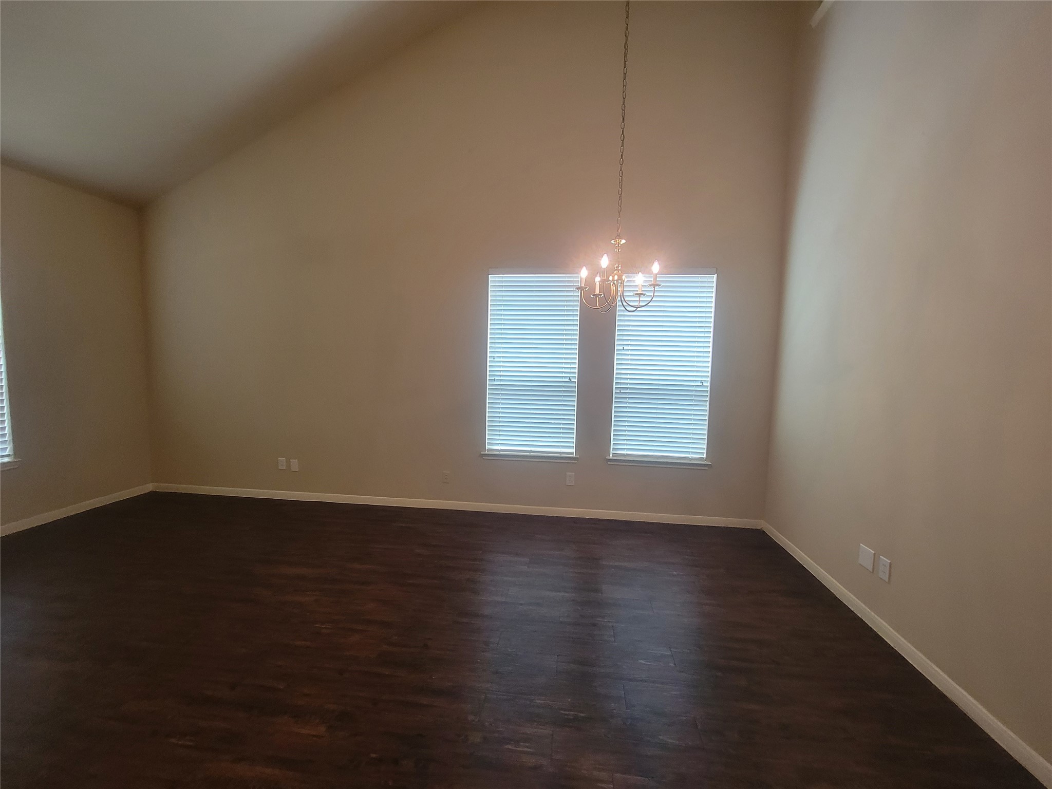3110 Clover Ranch Circle Katy, TX 77494 - Photo 3 of 28 a view of an empty room with wooden floor and a window