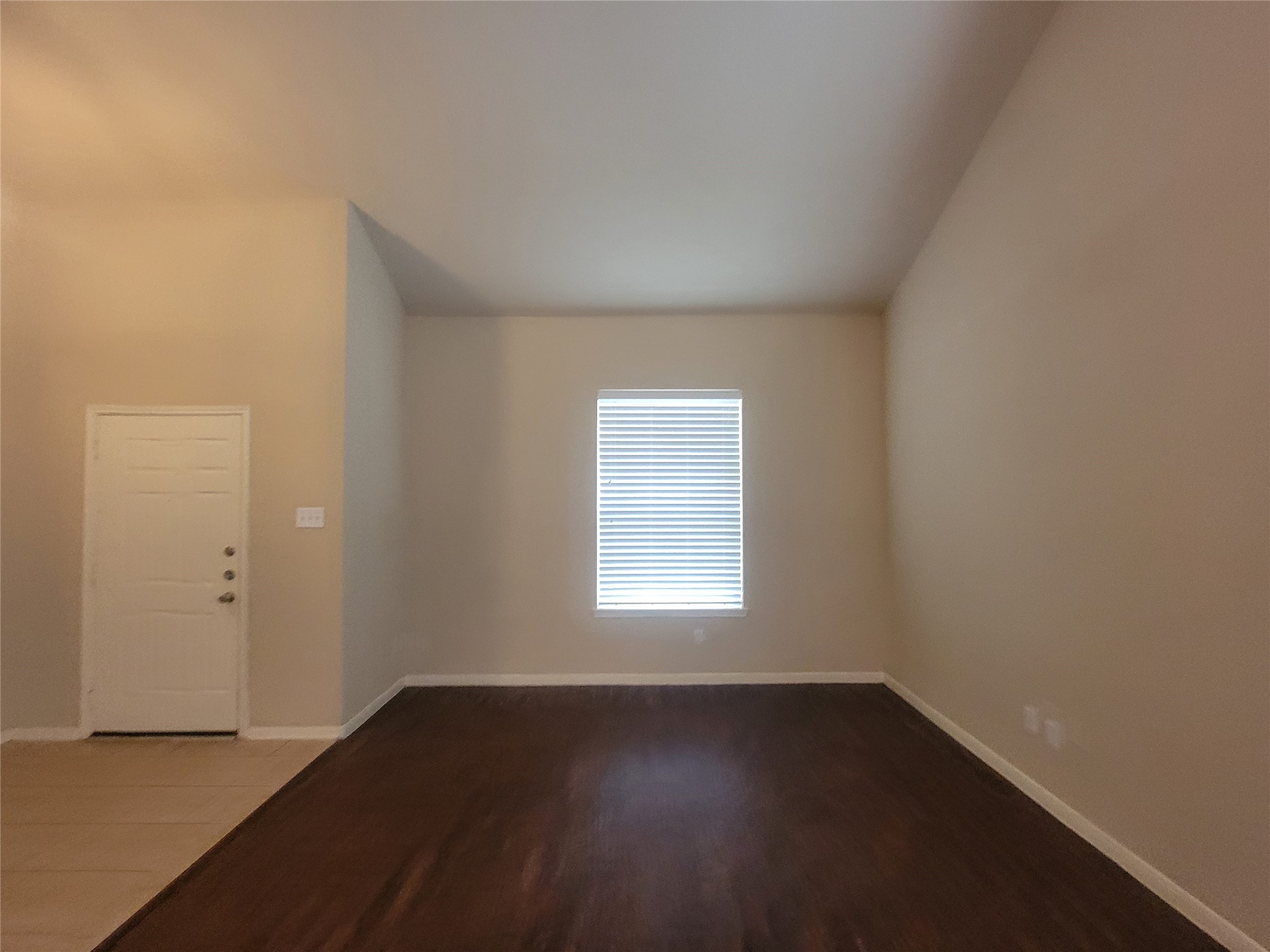 3110 Clover Ranch Circle Katy, TX 77494 - Photo 4 of 28 an empty room with wooden floor and windows