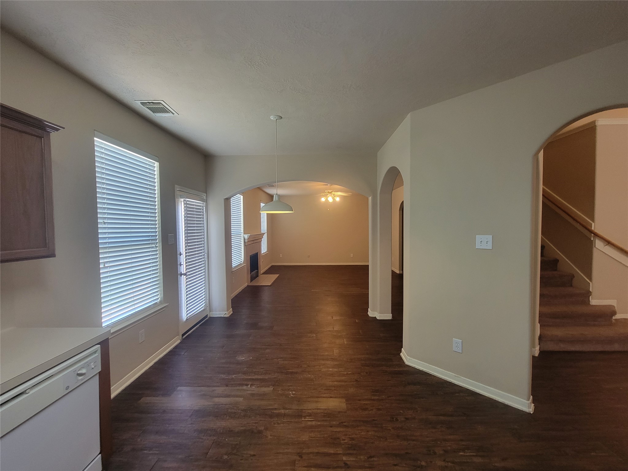 3110 Clover Ranch Circle Katy, TX 77494 - Photo 8 of 28 a view of a hallway with wooden floor and a living room