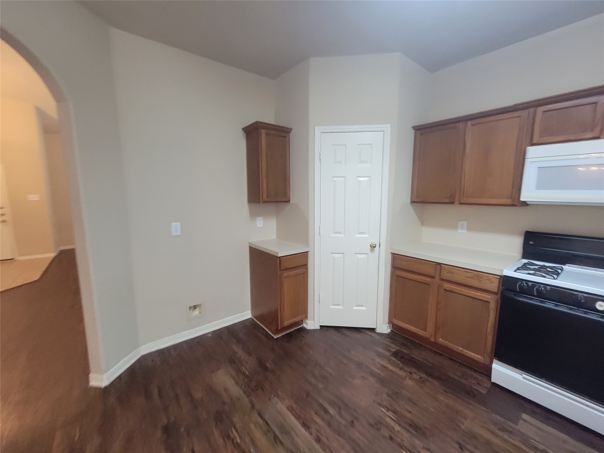 3110 Clover Ranch Circle Katy, TX 77494 - Photo 10 of 28 a kitchen with wooden floors and white appliances