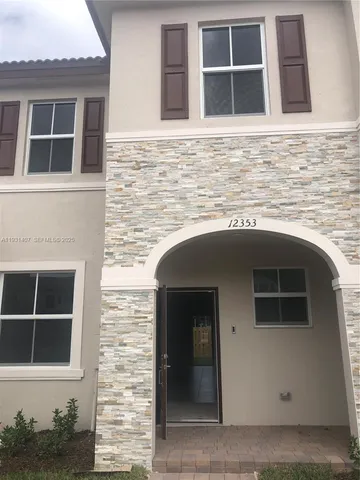 a front view of a house with an empty space