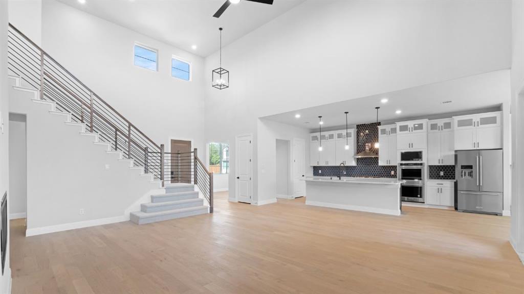 1608 Keneipp Road Carrollton, TX 75006 - Photo 4 of 13 a view of a kitchen with furniture and wooden floor