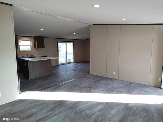 a view interior of a house kitchen wooden floor and electronic appliances