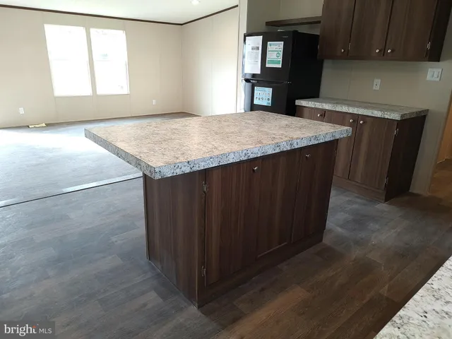 a kitchen with a wooden floor