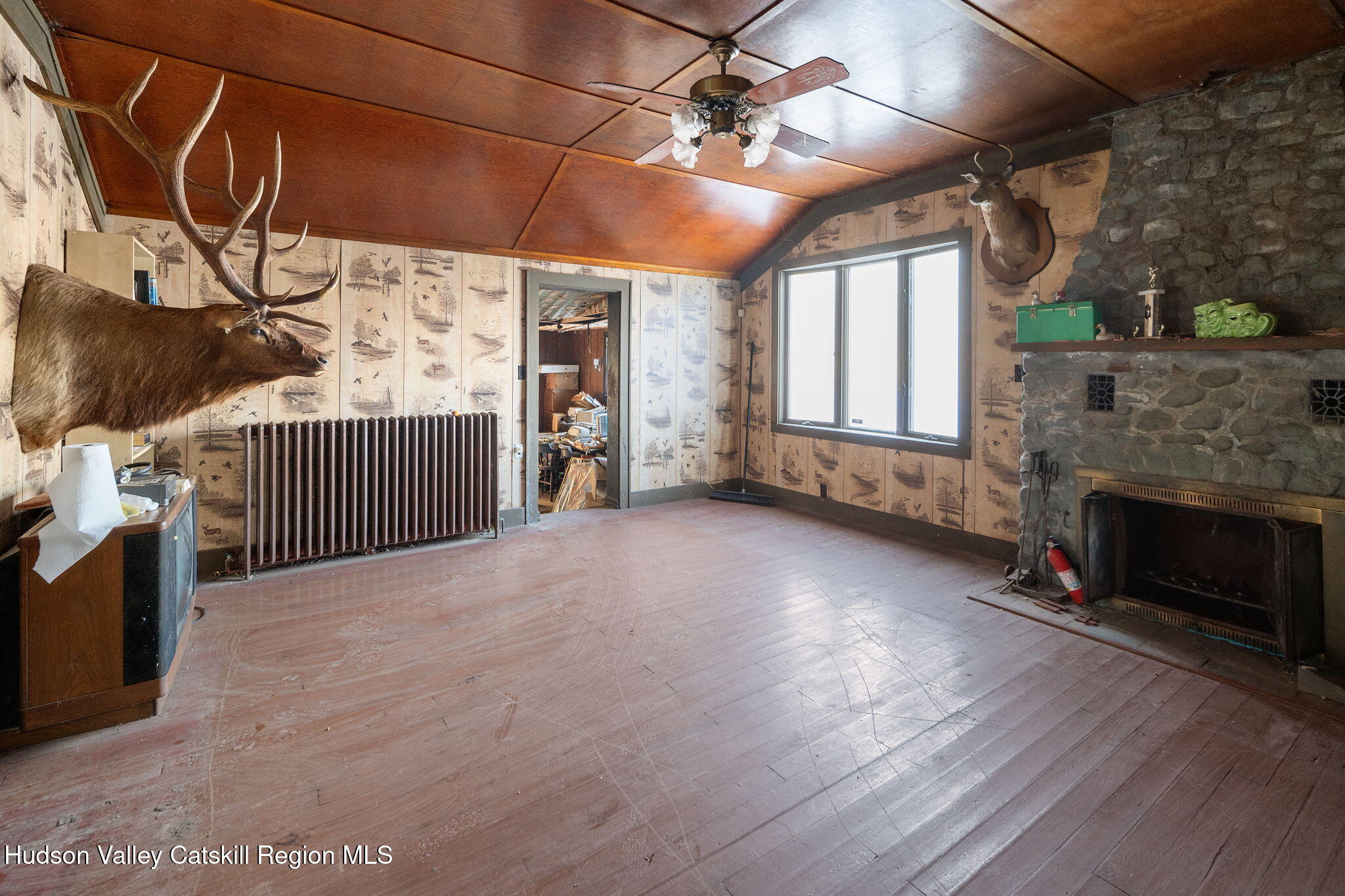 403 Blueberry Hill Road Middleburgh, NY 12122 - Photo 22 of 50 a view of a livingroom with furniture and a fireplace