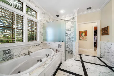 a living room with furniture a rug and a large window