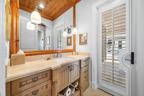 a white toilet sitting next to a bathroom sink