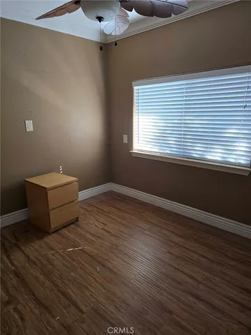 a room that has a chair and a wooden floor