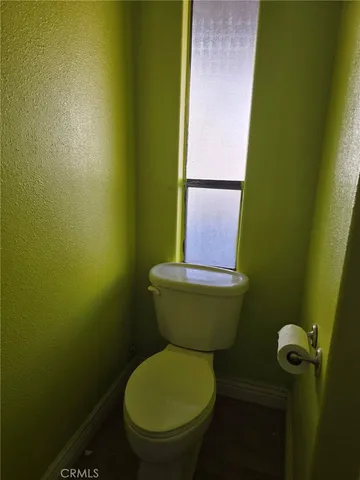 a bathroom with a toilet and a sink