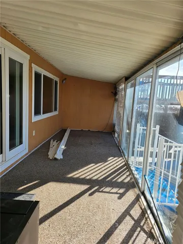 a view of a livingroom with wooden floor and stairs