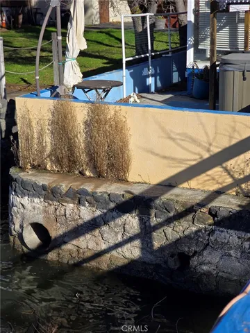 a view of swimming pool with outdoor seating and yard