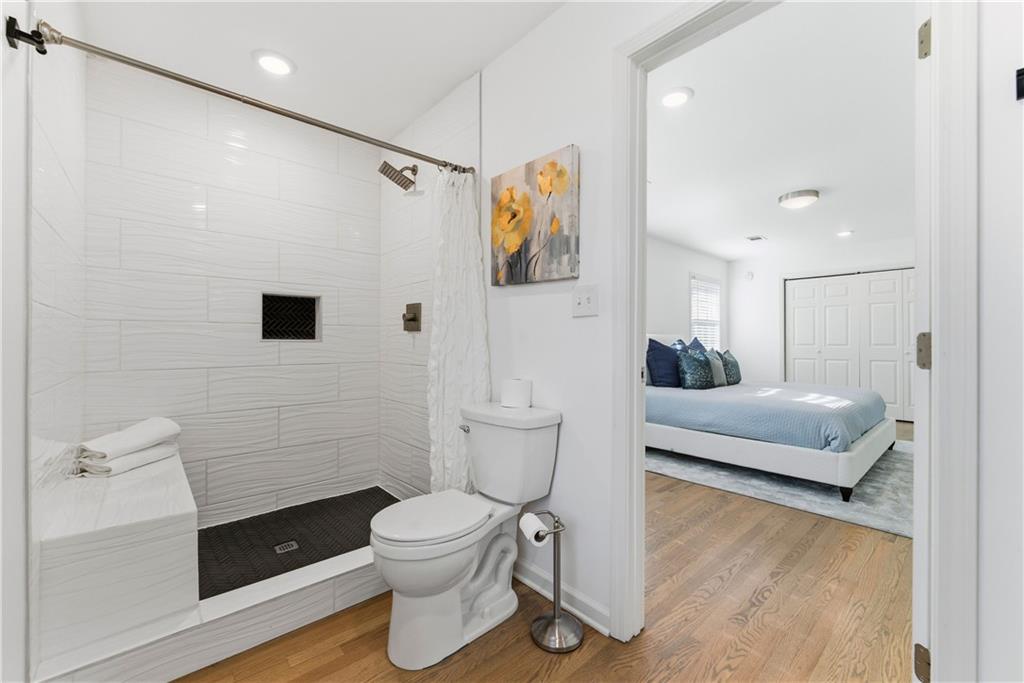 2975 Nursery Road Southeast Smyrna, GA 30082 - Photo 11 of 36 a bathroom with a toilet sink and shower