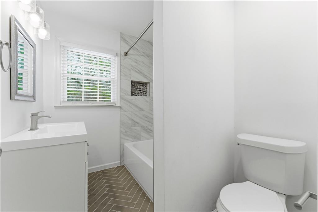 2975 Nursery Road Southeast Smyrna, GA 30082 - Photo 14 of 36 a bathroom with a toilet sink and mirror