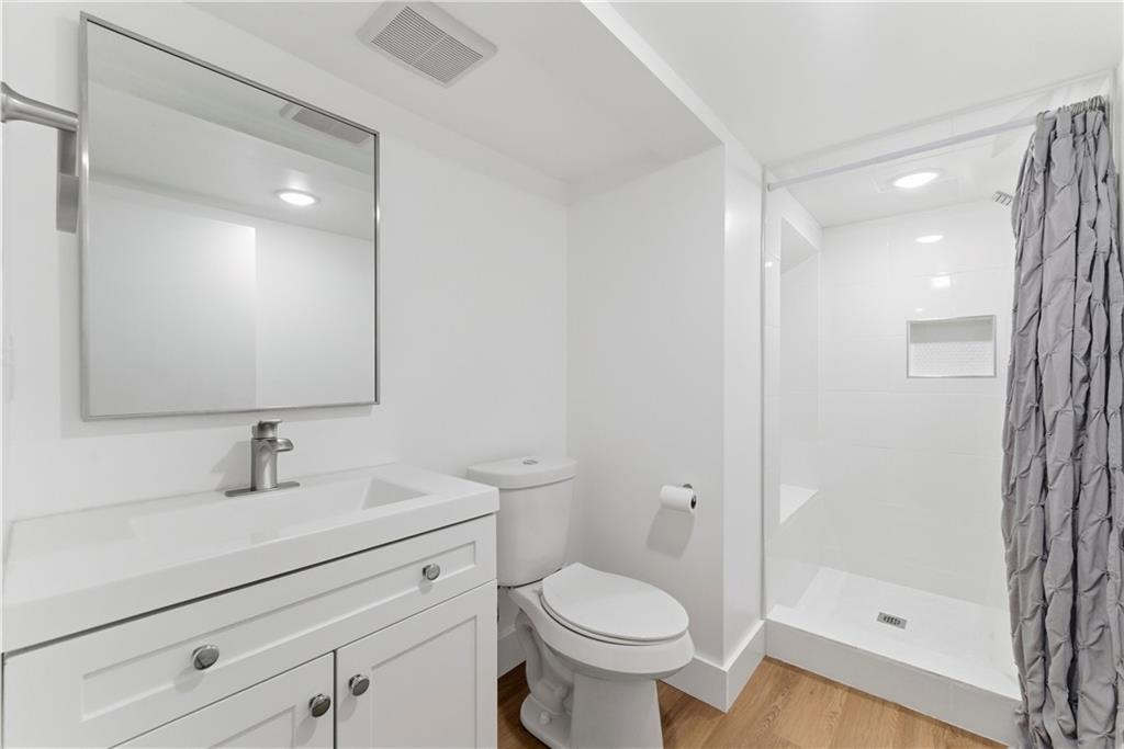 2975 Nursery Road Southeast Smyrna, GA 30082 - Photo 18 of 36 a bathroom with a sink toilet and shower